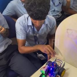 College students testing a robot car