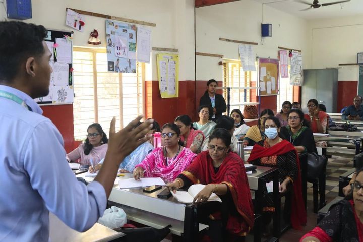 IRI trainer with teachers during a training session