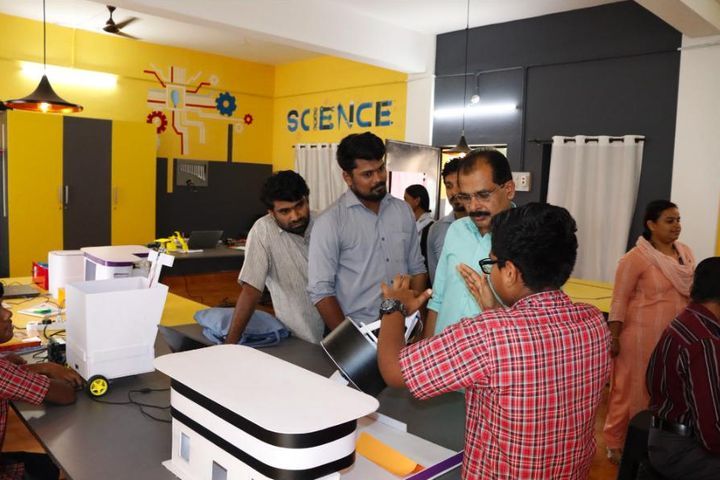 Teachers exploring student projects in a school science lab